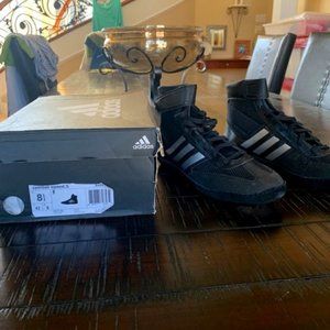 Un-used wrestling/boxing shoes.  Adidas, size 8.5, black and white.  IN BOX,,,